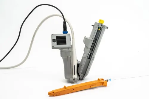 The AI-GUIDE device, along with an orange guidewire cartridge